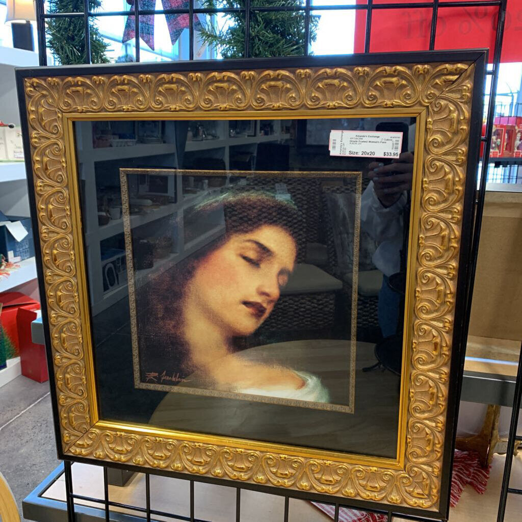 Ornate Framed Woman's Face