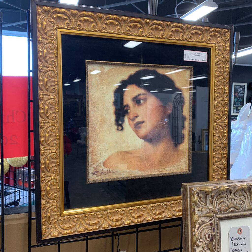 Ornate Framed Woman's Face