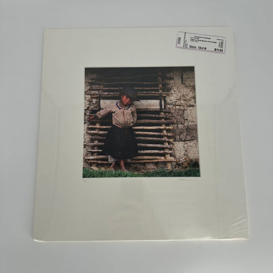 Child by Wall Matted Print